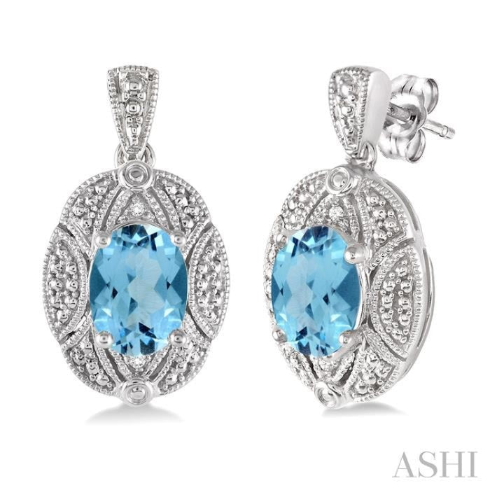 8x6 MM Oval Cut Blue Topaz and 1/50 Ctw Round Cut Diamond Earrings in Sterling Silver
