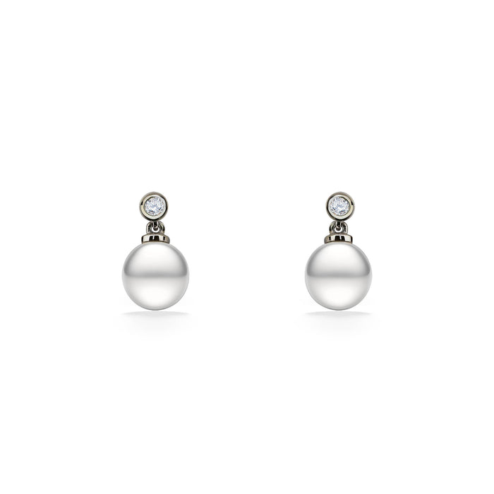 Drop earrings with white freshwater pearls beneath round white sapphires in a sterling silver bezel setting. Item No. 44537