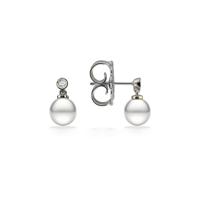 6mm white oval freshwater pearls dangle from posts with small bezel set white sapphires. Pearl stud earrings. Item No. 44537