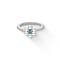 A blue topaz center surrounded by white freshwater pearls make a delicate sterling silver pearl flower ring. Item No. 44496